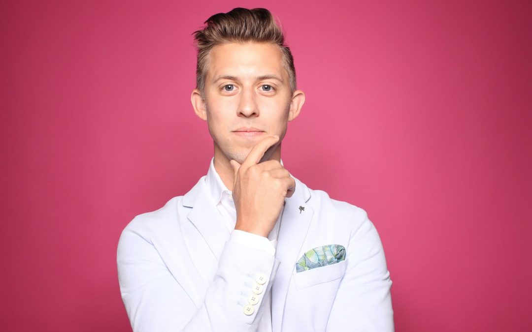 man in white suit jacket